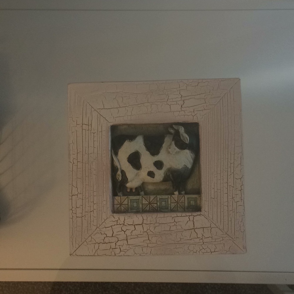 Wall hanging decor with a cow